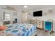 Coastal-themed bedroom with queen bed and dresser, offering a tranquil retreat at 303 48Th W St, Bradenton, FL 34209