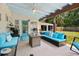 Outdoor patio with seating area and backyard view at 303 48Th W St, Bradenton, FL 34209