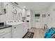 Laundry room with washer, dryer, and built-in cabinets at 303 48Th W St, Bradenton, FL 34209