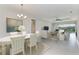 Bright dining room with large windows and chandelier at 12734 Rainwashed Loop, Parrish, FL 34219