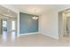 Dining room features tile floors and blue accent wall at 12734 Rainwashed Loop, Parrish, FL 34219