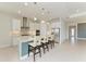 Modern kitchen with stainless steel appliances and island at 12734 Rainwashed Loop, Parrish, FL 34219