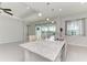 Kitchen features granite countertops and view of pool at 12734 Rainwashed Loop, Parrish, FL 34219