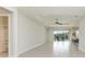 Open living room with tile floors and access to bathroom at 12734 Rainwashed Loop, Parrish, FL 34219