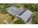 Aerial view of a beautiful home with a screened pool and solar panels at 3653 Bonaventure Ct, Sarasota, FL 34243