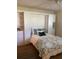 This bedroom features a built-in Murphy bed with shelving and a ceiling fan at 3653 Bonaventure Ct, Sarasota, FL 34243