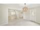 Open concept dining area, features a large window and modern light fixture at 500 Pameto Rd, Nokomis, FL 34275