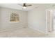 Simple bedroom with single window and ceiling fan at 500 Pameto Rd, Nokomis, FL 34275