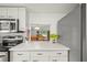Eat-in kitchen with stainless steel appliances and view to dining area at 3653 Bonaventure Ct, Sarasota, FL 34243