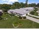 Aerial view of single-Gathering home with landscaped yard and driveway at 3653 Bonaventure Ct, Sarasota, FL 34243