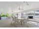 Bright community room with tables and chairs near the pool at 3653 Bonaventure Ct, Sarasota, FL 34243
