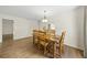 Simple dining room with wood table and chairs, near kitchen at 3653 Bonaventure Ct, Sarasota, FL 34243