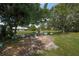 Serene pond with lush landscaping, creating a tranquil backyard setting at 3653 Bonaventure Ct, Sarasota, FL 34243