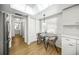 Kitchen features a small dining area and access to bathroom at 3653 Bonaventure Ct, Sarasota, FL 34243