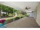 Spacious screened porch overlooking a pond and lush landscaping at 3653 Bonaventure Ct, Sarasota, FL 34243
