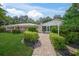 Landscaped walkway leads to the community pool and clubhouse at 3653 Bonaventure Ct, Sarasota, FL 34243