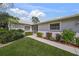 Front view of house with walkway and lush landscaping at 3653 Bonaventure Ct, Sarasota, FL 34243