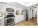 Updated kitchen with stainless steel appliances and a breakfast bar at 3653 Bonaventure Ct, Sarasota, FL 34243