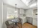 Cozy kitchen nook with a small table and chairs near the sink at 3653 Bonaventure Ct, Sarasota, FL 34243