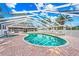 Community pool and spa with covered patio and lounge chairs at 3653 Bonaventure Ct, Sarasota, FL 34243