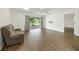 Bright living room with wood floors and access to another room at 3653 Bonaventure Ct, Sarasota, FL 34243