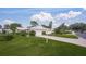 House exterior with driveway, landscaping, and two-car garage at 3653 Bonaventure Ct, Sarasota, FL 34243