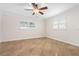 Bright bedroom with tile flooring, ceiling fan, and large windows at 3072 Meyer Dr, Sarasota, FL 34239