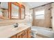 Bathroom features wood vanity, tile flooring, and bathtub at 3072 Meyer Dr, Sarasota, FL 34239