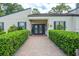 Building entrance with landscaping and walkway at 1111 Longfellow Rd # 1111, Sarasota, FL 34243