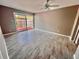 Bright living room with tile flooring and sliding glass doors leading to a patio at 1111 Longfellow Rd # 1111, Sarasota, FL 34243