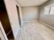 Bright bedroom with tile floors and a large closet at 1111 Longfellow Rd # 1111, Sarasota, FL 34243