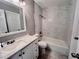 Clean bathroom with a bathtub, updated vanity, and tile floor at 1111 Longfellow Rd # 1111, Sarasota, FL 34243