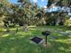Community BBQ area with grills and picnic tables at 1111 Longfellow Rd # 1111, Sarasota, FL 34243