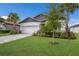 Well-maintained house exterior with gray siding, tile roof, and a neatly landscaped front yard at 3822 Savanna Palms Ct, Bradenton, FL 34211