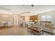 Open living room and kitchen with breakfast bar at 7546 Divot Loop, Lakewood Ranch, FL 34202