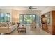 Relaxing living room with lake views and a comfy sofa at 7546 Divot Loop, Lakewood Ranch, FL 34202