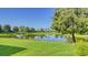 Beautiful pond with lush landscaping and clear reflection at 7546 Divot Loop, Lakewood Ranch, FL 34202