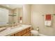 Bathroom with single vanity, toilet and shower/tub combo at 7546 Divot Loop, Lakewood Ranch, FL 34202