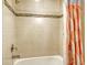 Bathroom with tub, shower, and patterned shower curtain at 7546 Divot Loop, Lakewood Ranch, FL 34202