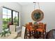 Community room with a seating area and large mirror at 7546 Divot Loop, Lakewood Ranch, FL 34202