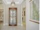 Bright entryway with a charming display cabinet at 7546 Divot Loop, Lakewood Ranch, FL 34202