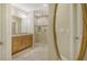 Bathroom features granite vanity, large glass shower, and oval mirror at 7546 Divot Loop, Lakewood Ranch, FL 34202