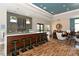 Relaxing lounge with a bar and comfortable seating at 7546 Divot Loop, Lakewood Ranch, FL 34202