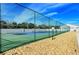 Tennis court surrounded by a chain link fence at 4271 Carol Ann Rd # 24, Sarasota, FL 34233