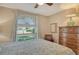 Bright bedroom with a comfortable bed, dresser, and window seat at 4271 Carol Ann Rd # 24, Sarasota, FL 34233