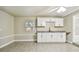 Modern galley kitchen with white shaker cabinets, granite countertops, and black hardware at 3419 19Th E St, Bradenton, FL 34208