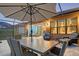 Screened patio with dining table and seating area at 8744 Bellussi Dr, Sarasota, FL 34238
