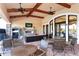 Outdoor seating area near pool with tables and chairs at 8744 Bellussi Dr, Sarasota, FL 34238