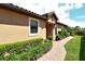 Side yard with walkway leading to the front entrance at 8744 Bellussi Dr, Sarasota, FL 34238