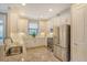 Modern kitchen with white cabinets, granite countertops, and stainless steel appliances at 8744 Bellussi Dr, Sarasota, FL 34238